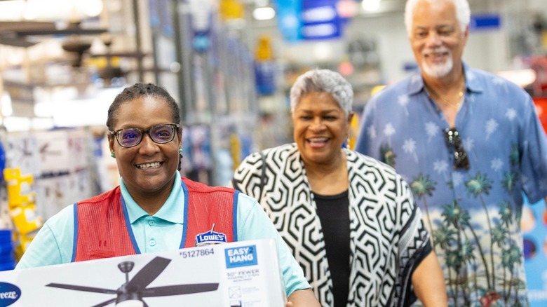 Lowe's employee helping customers