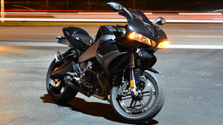 A Midnight Black 2009 1125R with Jardine RT-5 Carbon exhaust, Buell Select seat, fender eliminator kit, and amber side-markers.