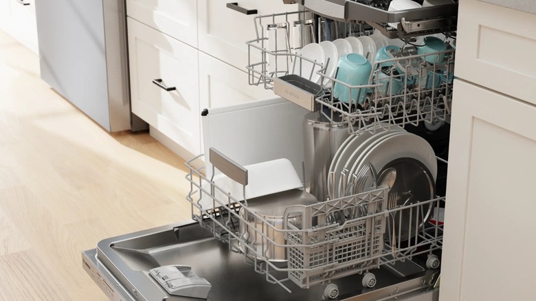 A Bosch dishwasher full of dishes.