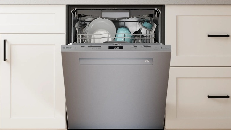 A Bosch dishwasher opening to reveal dishes.