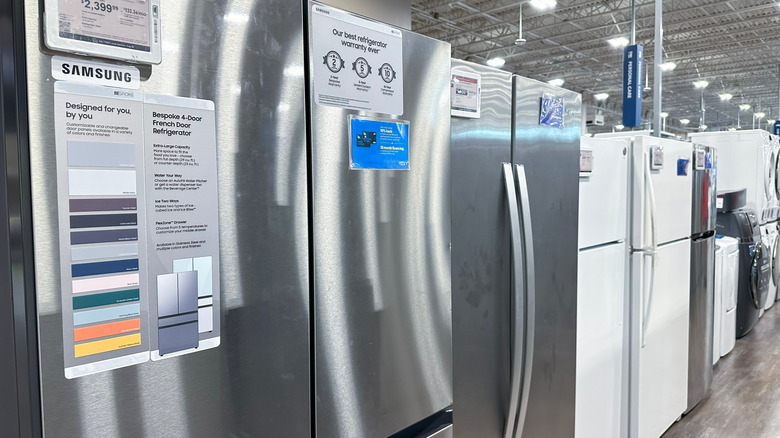 Samsung refrigerators on display in a store.