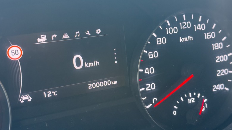 Car dashboard showing odometer and information