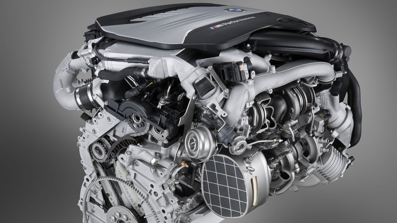 Front 3/4 view of BMW N57S diesel engine in studio setting