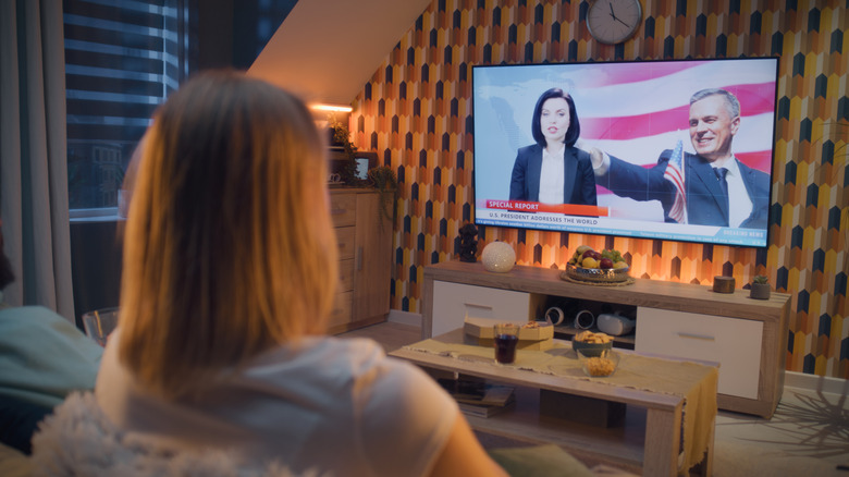 A person watching live TV