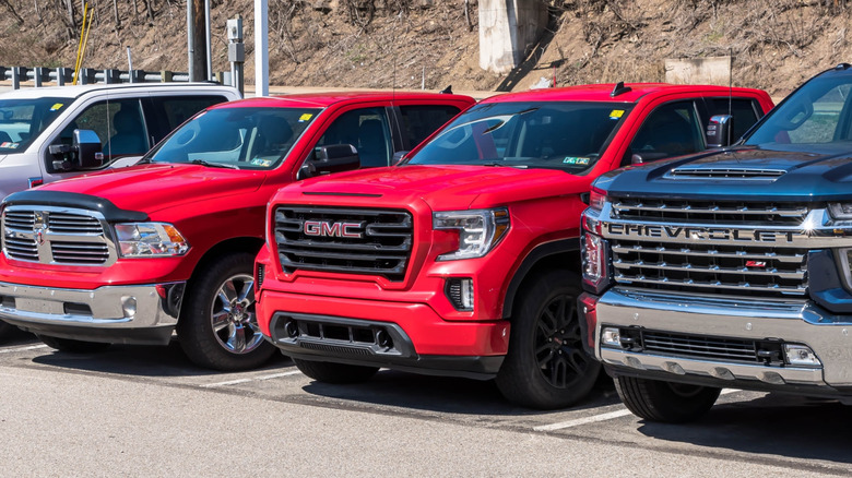 Picture showing various pickup trucks in a parking lot