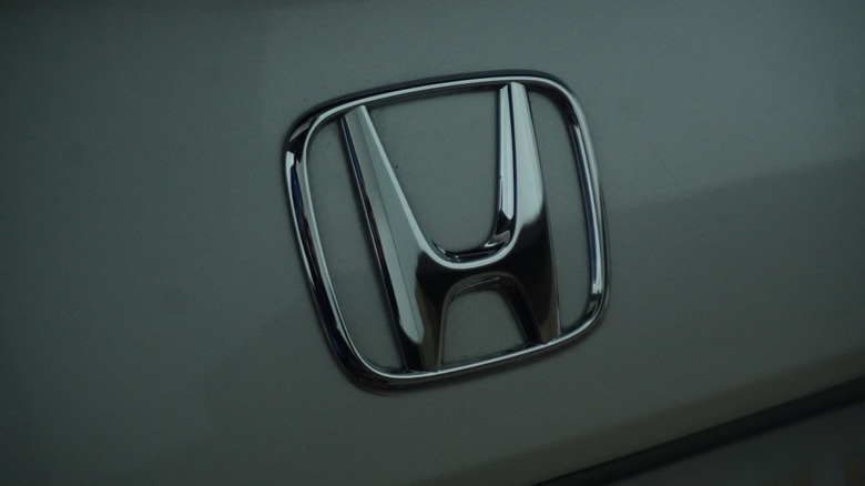 Close up of the Honda logo on a car