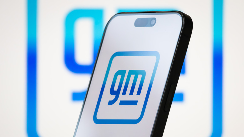 GM logo on a smartphone screen