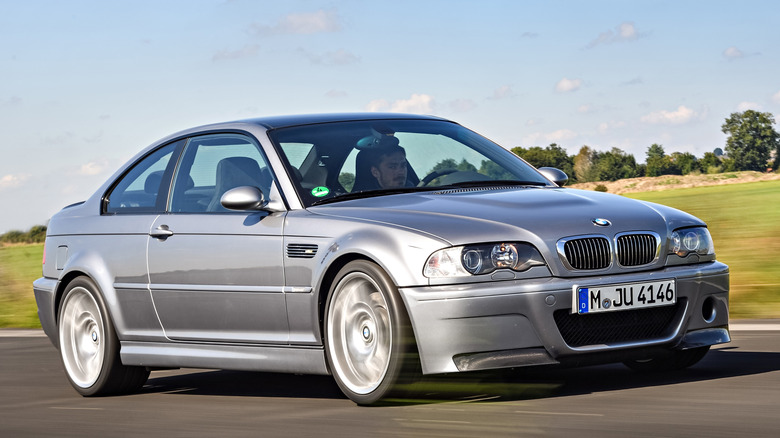Front 3/4 view of BMW E46 M3 CSL driving in track setting