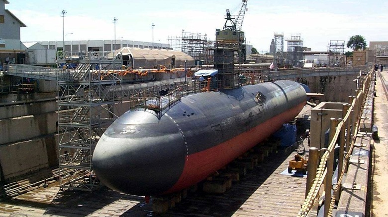 USS Greenville (SSN-772) in drydock drained of seawater at a shipyard