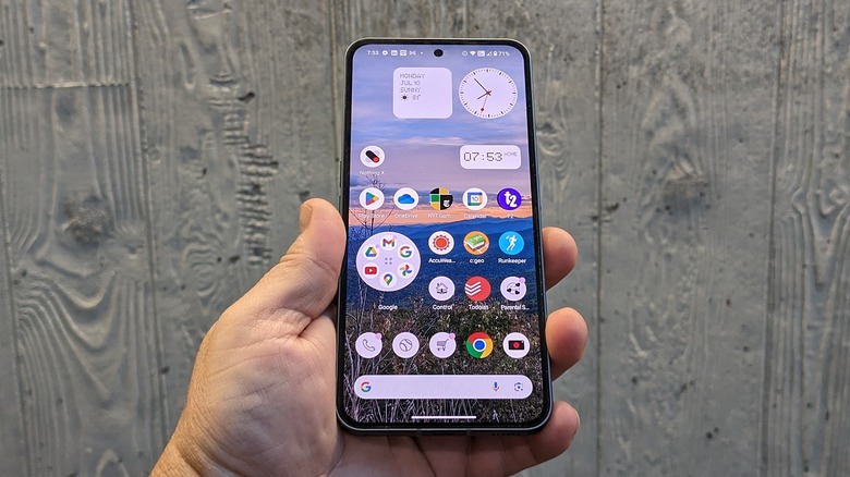 Man holding Nothing Phone (2)