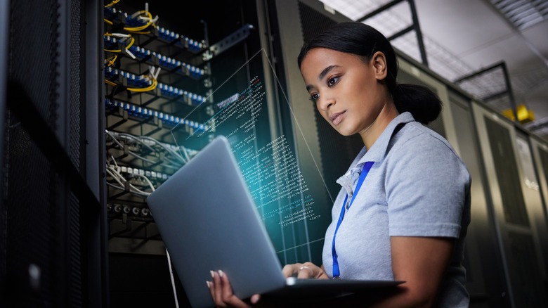 A woman working in a data center.