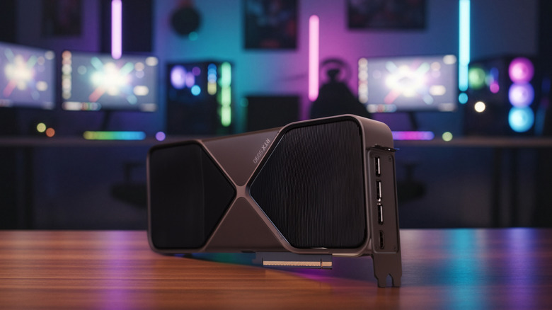 An Nvidia GeForce RTX 5090 GPU in front of a couple of gaming PCs