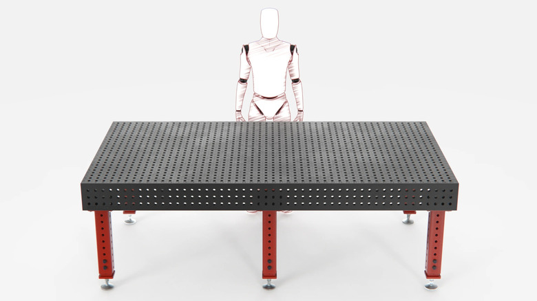 Illustration of a person stands behind Fireball Tool heavy duty welding fixture table.