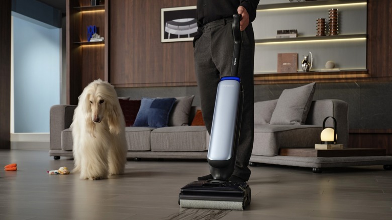 Tineco FLOOR ONE S9 Artist PRO in use with a dog looking on