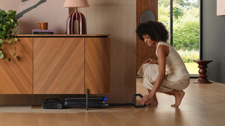 Tineco FLOOR ONE S9 Artist Pro using Lay-Flat design to reach under furniture