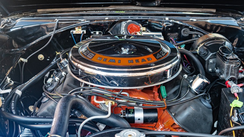 Chrysler Hemi 426 cubic-inch engine under hood of muscle car