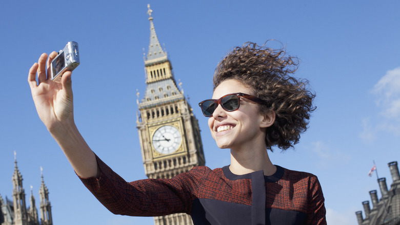 Person taking selfie with digital camera