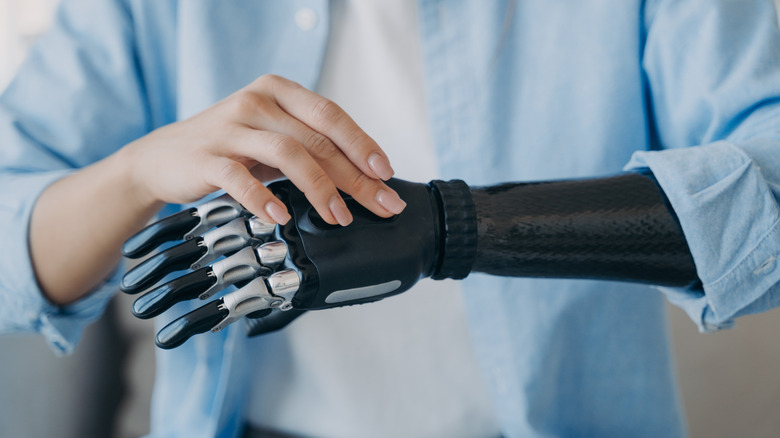 Woman changes settings on cyber hand