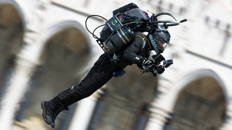 Jetpack pilot flying by Hungarian Parliament Building