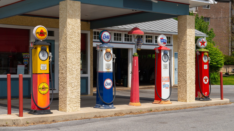 vintage gas pumps in a row