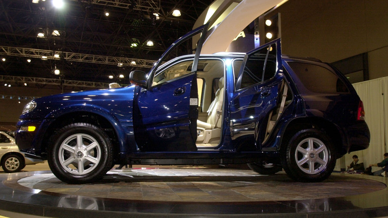Oldsmobile Bravada SUV at 2001 New York Auto Show, side profile, doors open