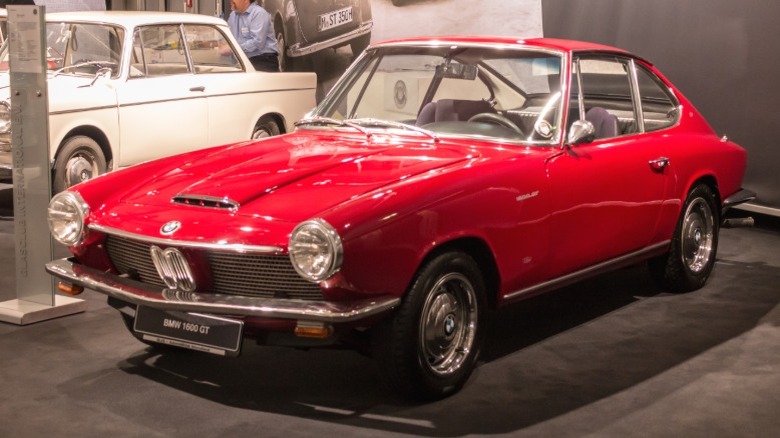 Red BMW 1600 GT on display at an indoor exhibit