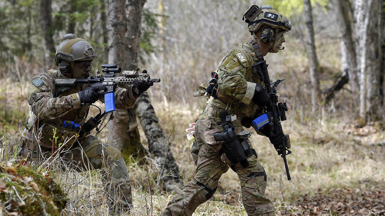 pararescue team exercise in forest