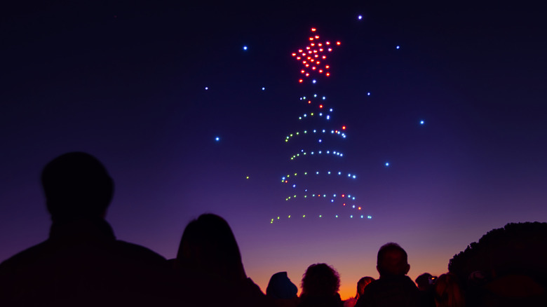 People watching a drone show.