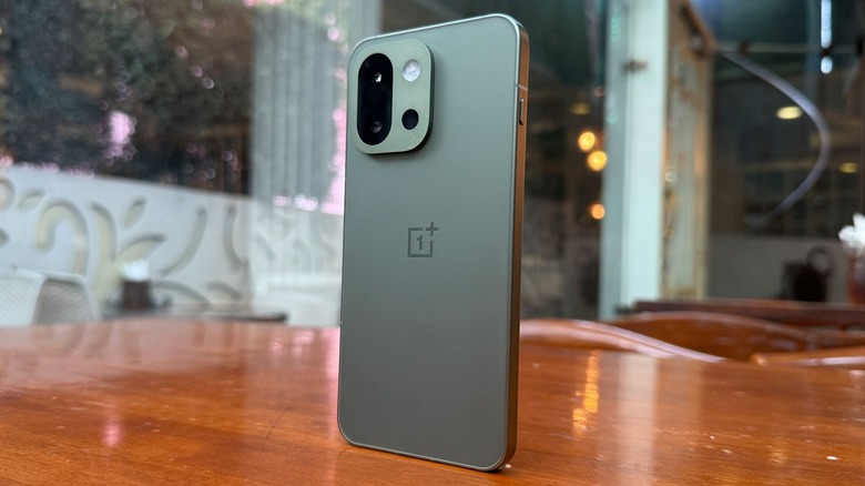 OnePlus 13s standing on a table.