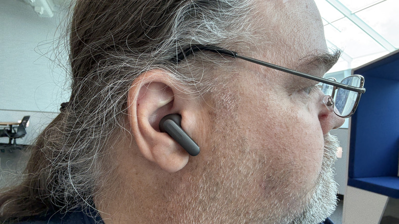 Man wearing OnePlus Buds 4