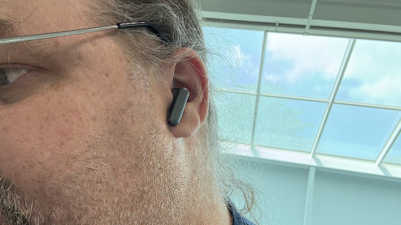 Man wearing OnePlus Buds 4