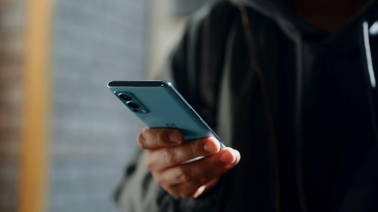 Man holding a OnePlus Nord 2