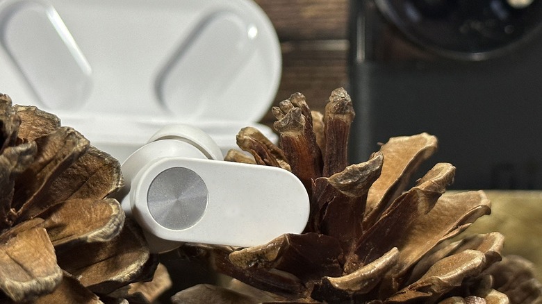 earbud in front of phone