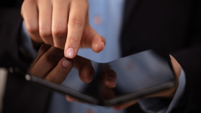 Person using a foldable phone.