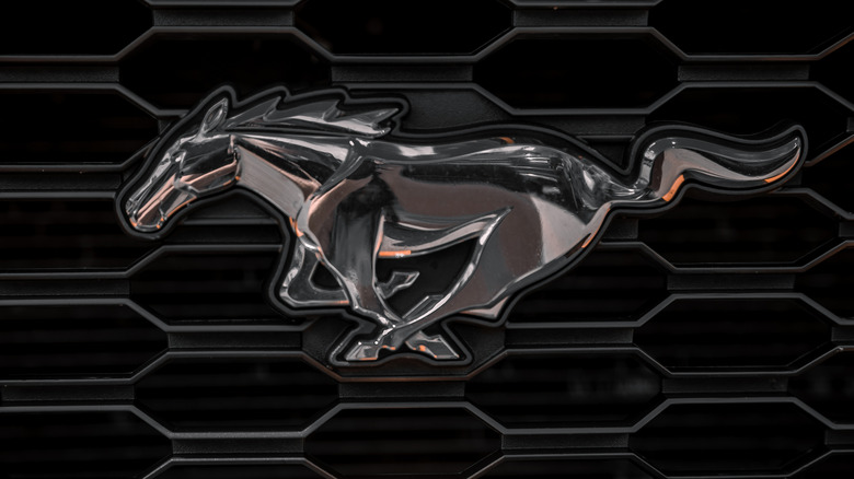 The Mustang badge on the grille of an unknown Mustang generation