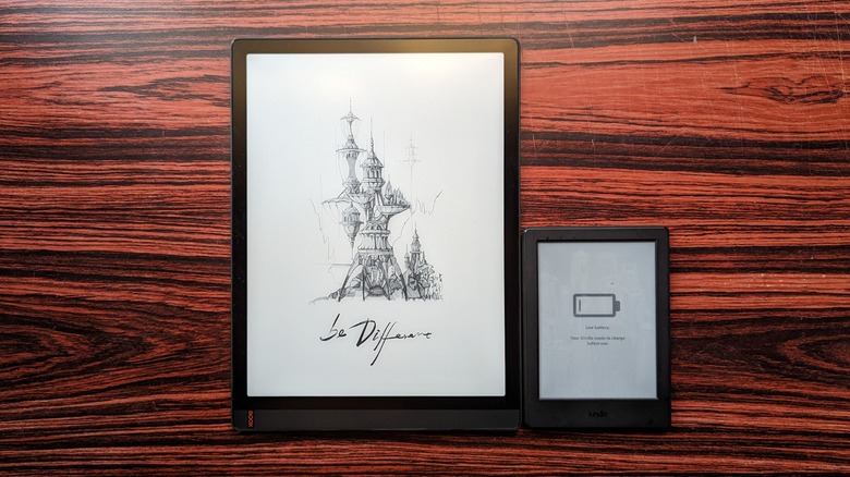 Onyx Boox Tab X next to a regular Kindle