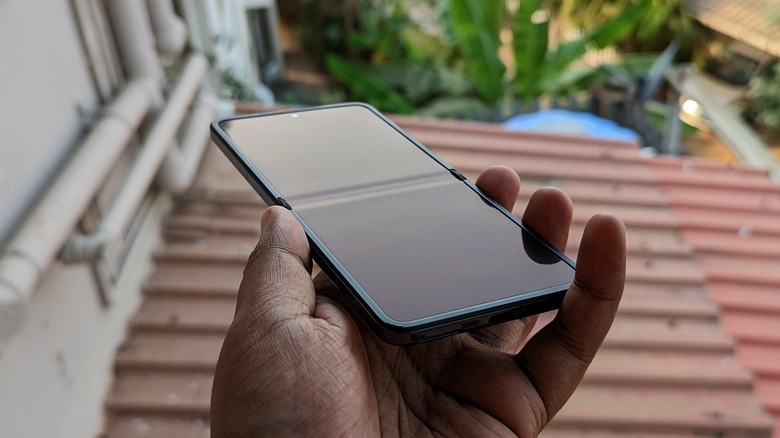 Oppo Find N2 Flip opened, held in hands, showing display crease