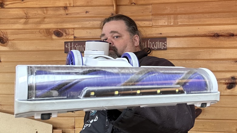 Man holding vacuum
