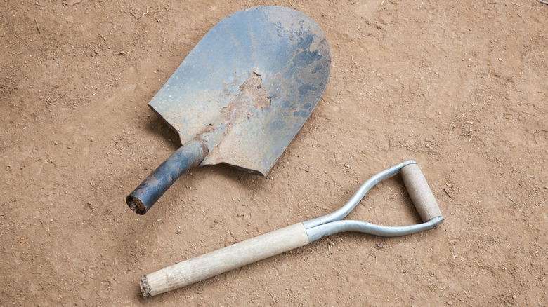 a broken shovel on the ground