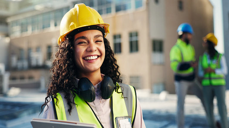 worker wearing hard hat and reflective vest