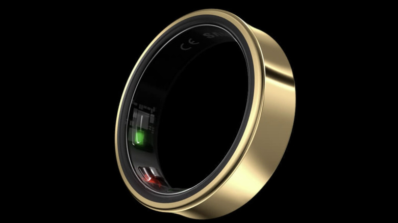 A gold Samsung Galaxy Ring shown against a black background