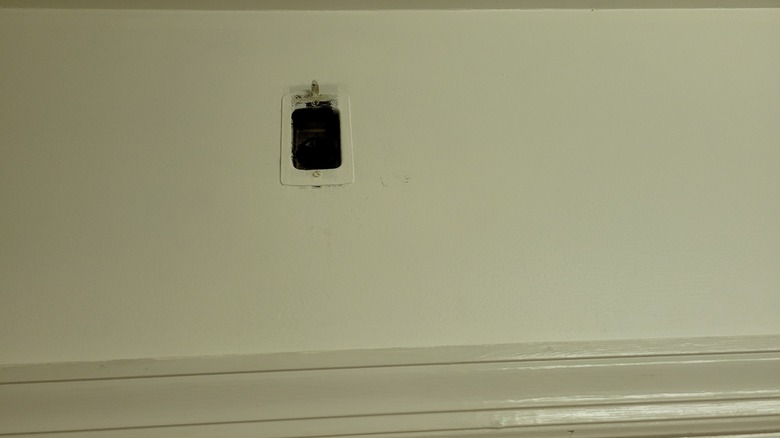 power outlet above a door
