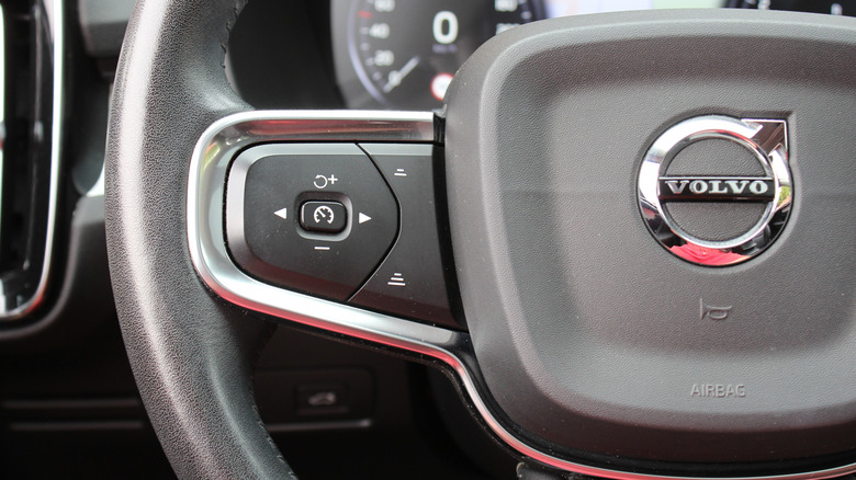 The Volvo badge on the grill of a vehicle.