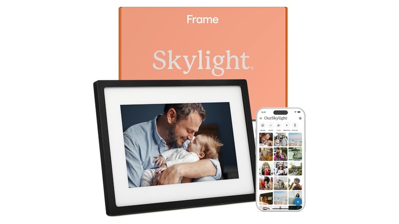 Digital photo frame displaying a man holding a baby