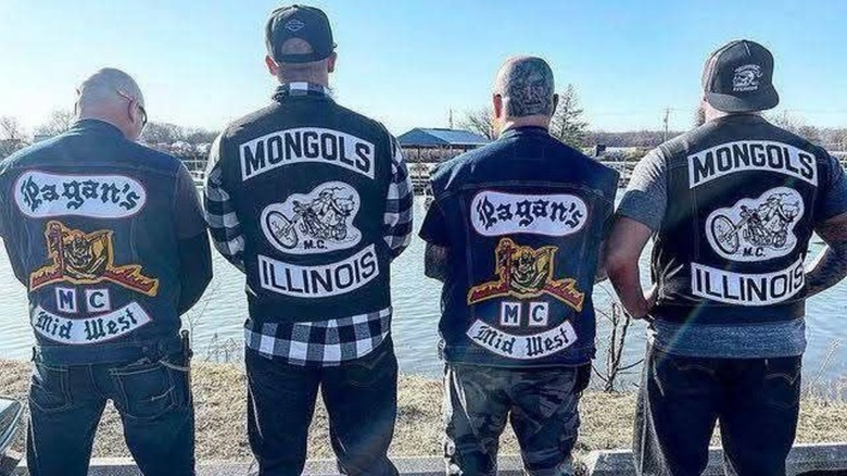 Two Pagans members and two Mongols members standing shoulder to shoulder