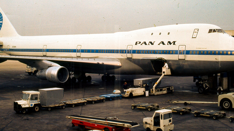 A vintage photo luggage being loaded onto a Pan Am plane in the 1970s