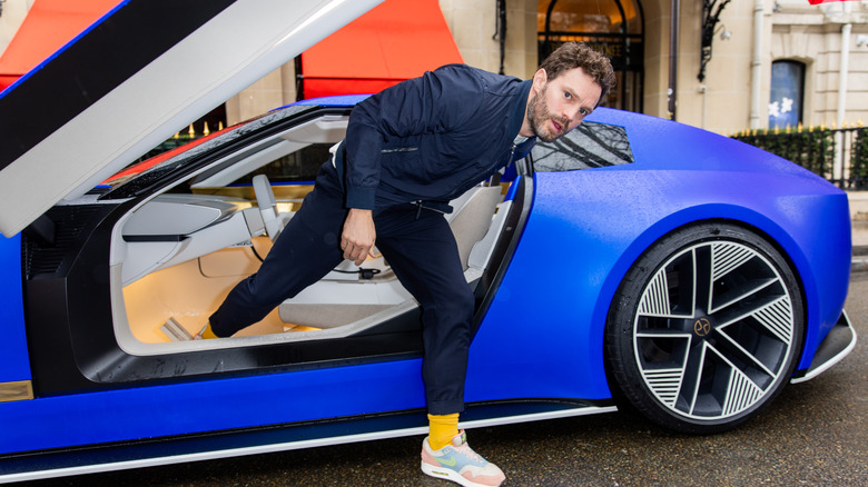 man stepping out of Jaguar Type 00 in Paris