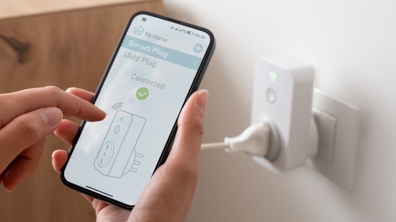 person using smart plug app