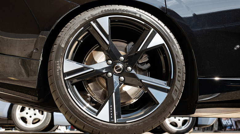 Side view of a black Volvo alloy wheel with Pirelli tire