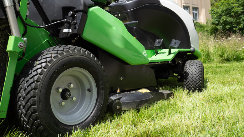 A closeup of a riding mower's tires